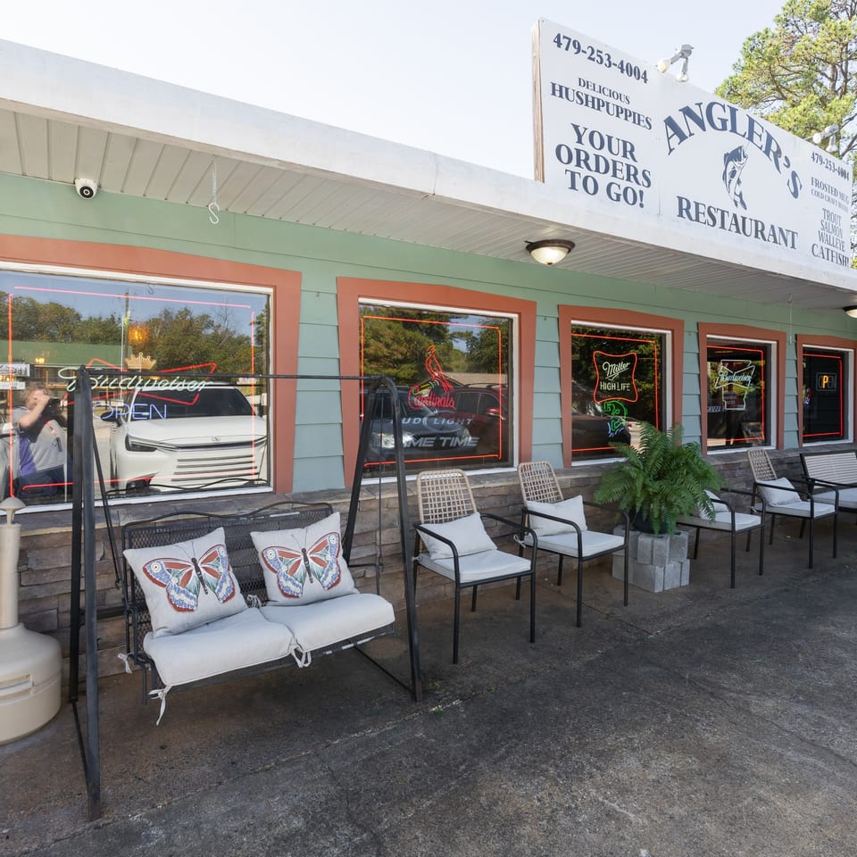 Angler's restaurant front with outdoor seating.